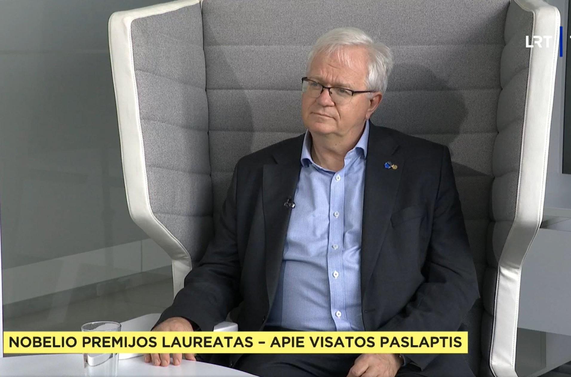 Brian Schmidt sitting in a chair being interviewed