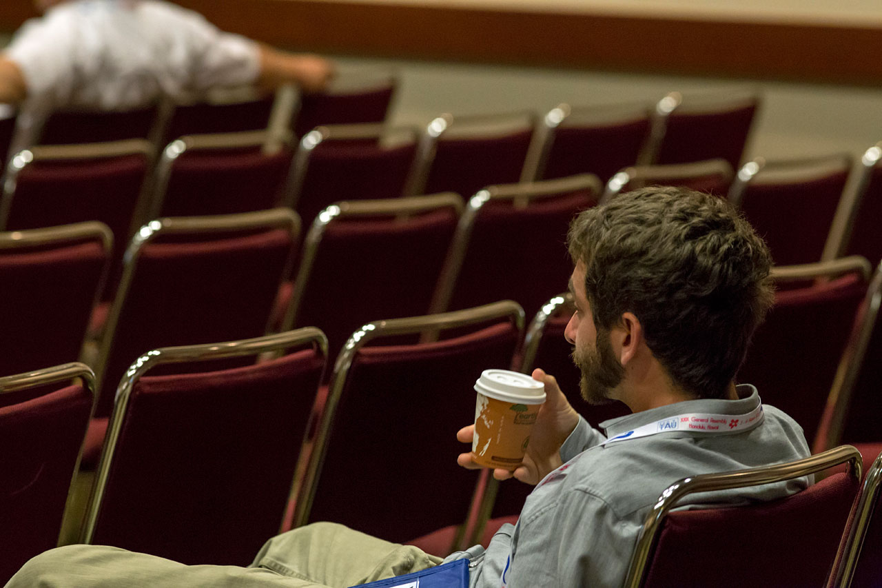 Man with coffee at the IAU XXIX General Assembly